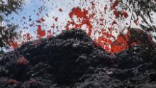 PAHOA, HI - MAY 12:  A lava fissure erupts in the aftermath of eruptions from the Kilauea volcano on Hawaii's Big Island, on May 12, 2018 in Pahoa, Hawaii. The U.S. Geological Survey said a recent lowering of the lava lake at the volcano's Halemaumau crater Òhas raised the potential for explosive eruptionsÓ at the volcano. Authorities have confirmed the fissure is the 16th to open.  (Photo by Mario Tama/Getty Images)