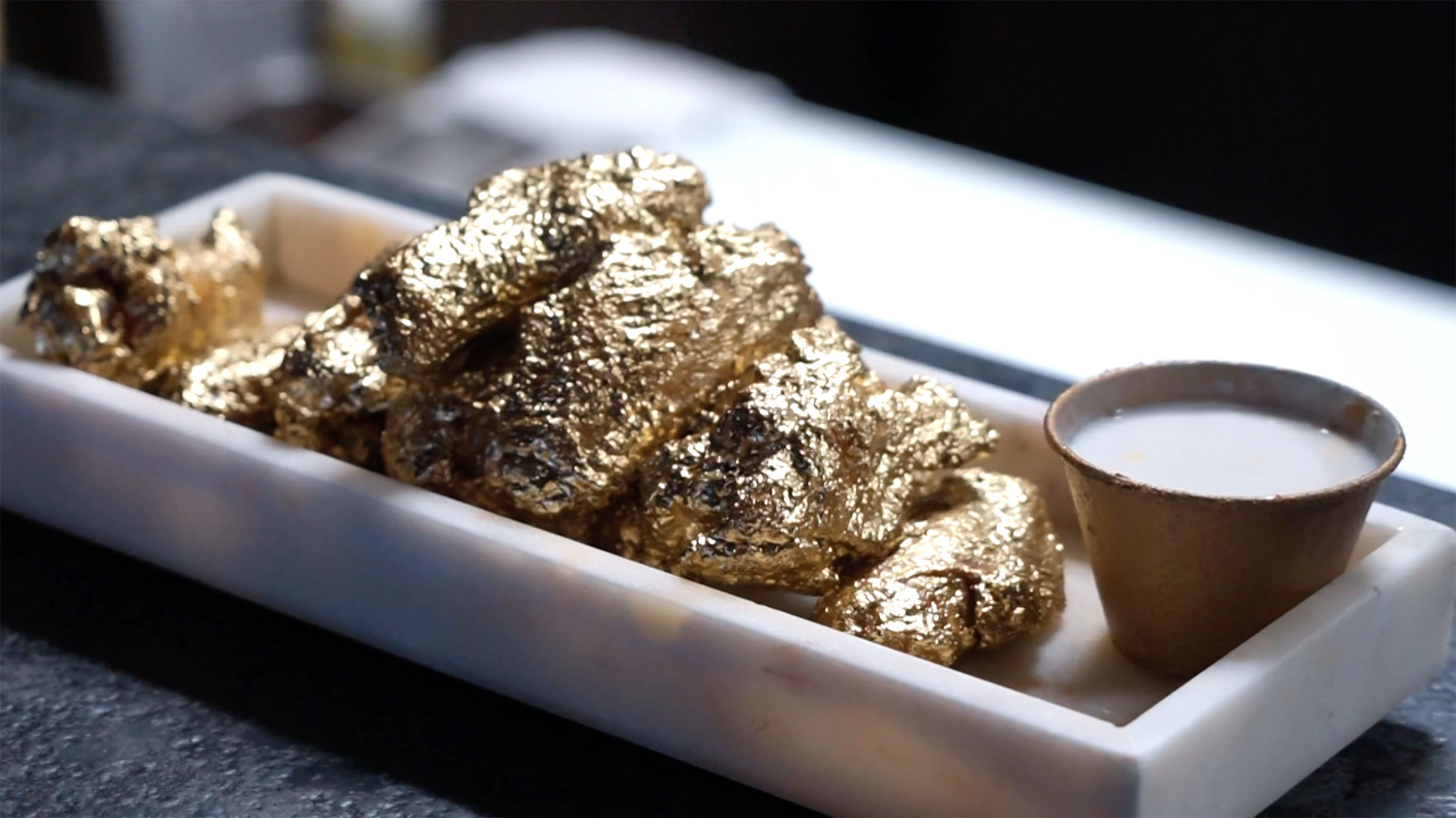 These 24K chicken wings redefine golden - CNN Video