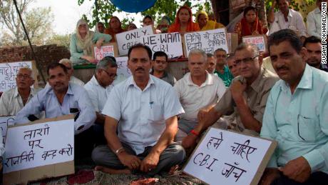 Hindu Ekta Manch&#39;s president Vijay Kumar Sharma (center, white shirt). Members of the activist group maintain that the accused men are innocent and are calling for an independent  investigation.  