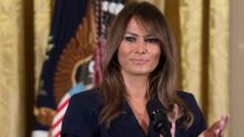 US President Donald Trump stands alongside First Lady Melania Trump (R) during an event in honor of Military Mothers and Spouses in the East Room of the White House in Washington, DC, May 9, 2018. (Photo by SAUL LOEB / AFP)        (Photo credit should read SAUL LOEB/AFP/Getty Images)