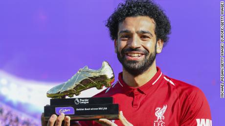 LIVERPOOL, ENGLAND - MAY 13: Mohamed Salah of Liverpool poses for a photo with his Premier League Golden Boot Award after the Premier League match between Liverpool and Brighton and Hove Albion at Anfield on May 13, 2018 in Liverpool, England. (Photo by Michael Regan/Getty Images)