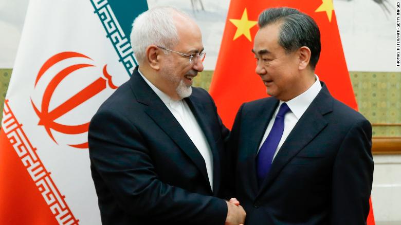 Chinese State Councillor and Foreign Minister Wang Yi (R) meets Iran's Javad Zarif at the Diaoyutai state guesthouse in Beijing on May 13.