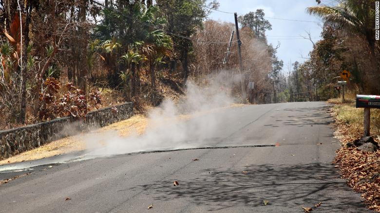 Toxic sulfur dioxide seeps out of the street in Leilani Estates, Hawaii.