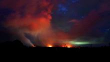 Lava shoots into the night sky from active fissures on the lower east rift of Kilauea volcano, Tuesday, May 15, 2018 near Pahoa, Hawaii. (AP Photo/Caleb Jones)