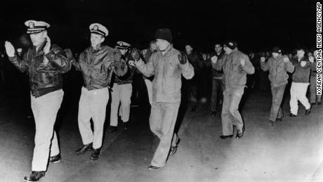 Crew from the USS Pueblo being captured by North Korea on January 23, 1968.