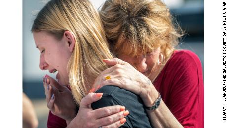 Santa Fe High School student Dakota Shrader is comforted by her mother Susan Davidson following a shooting at the school on Friday, May 18, 2018, in Santa Fe, Texas. Shrader said her friend was shot in the incident.  (Stuart Villanueva/The Galveston County Daily News via AP)