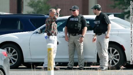 Police officers work a check point in front of Santa Fe High School in response to a shooting at the school on Friday, May 18, 2018, in Santa Fe, Texas. (Kevin M. Cox /The Galveston County Daily News via AP)