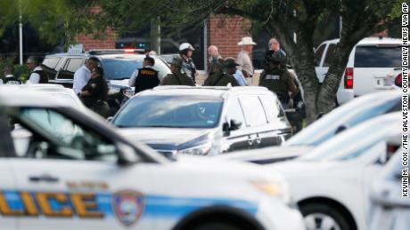 Emergency responders from multiple agencies work at the scene in front of Santa Fe High School in response to a shooting on Friday, May 18, 2018, in Santa Fe, Texas. (Kevin M. Cox /The Galveston County Daily News via AP)