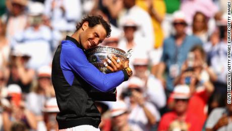 PARIS, FRANCE - JUNE 11:  Rafael Nadal of Spain celebrates victory with the trophy following the mens singles final against Stan Wawrinka of Switzerland on day fifteen of the 2017 French Open at Roland Garros on June 11, 2017 in Paris, France.  (Photo by Clive Brunskill/Getty Images)