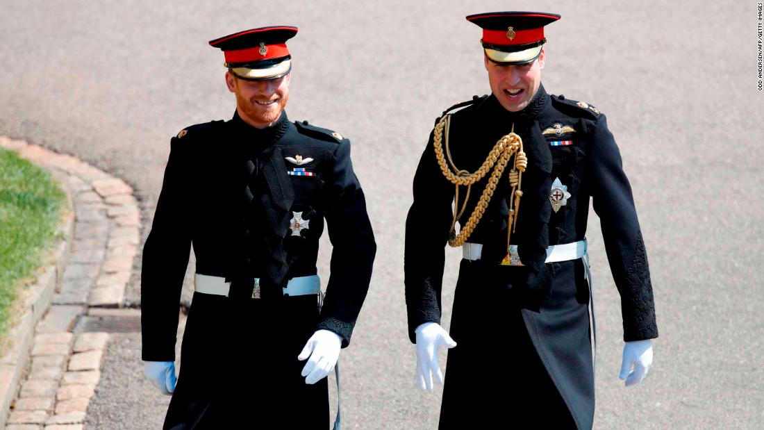 Britain&#39;s Prince Harry and his best man Prince William wore military dress uniforms.