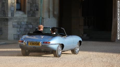 The Duke and Duchess of Sussex leave Windsor Castle in an E-Type Jaguar. The registration plate bore the date of their wedding day. 
