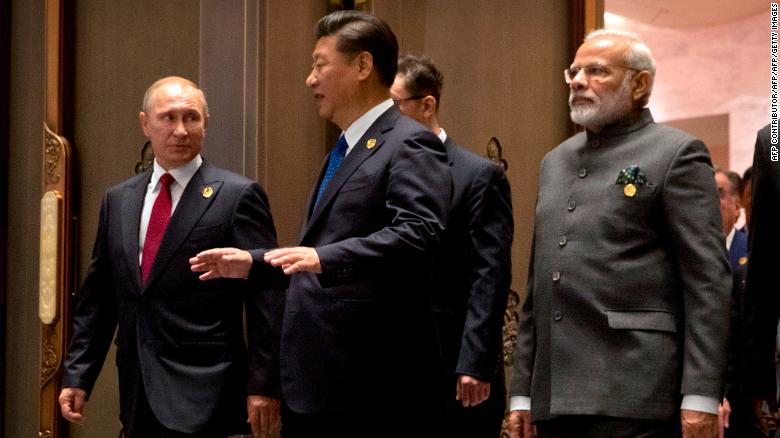 Russian President Vladimir Putin, Chinese President Xi Jinping and Indian Prime Minister Narendra Modi arrive for the Dialogue of Emerging Market and Developing Countries on the sidelines of the 2017 BRICS Summit in Xiamen, southeastern China&#39;s Fujian Province on September 5, 2017.