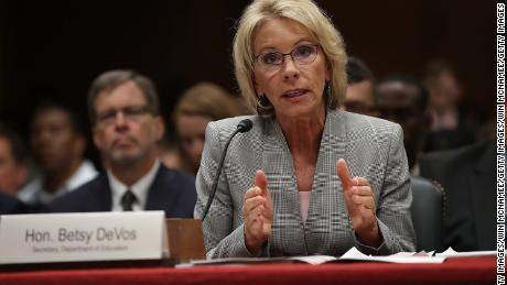 Education secretary says schools should decide whether to report undocumented students. Civil rights groups say she's wrong.