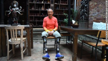 This photograph taken on April 4, 2018 shows Chinese double amputee climber Xia Boyu, who lost both of his legs during first attempt to climb Everest, during an interview with AFP at Bhaktapur on the outskirts of Kathmandu, ahead of another attempt to climb the mountain.
The Chinese climber who lost both his legs to frostbite on Everest four decades ago is hoping to finally reach the summit of the world&#39;s highest peak, after Nepal&#39;s top court overruled a government ban on double amputees climbing its mountains. / AFP PHOTO / PRAKASH MATHEMA / TO GO WITH Nepal-China-mountaineering-disabled,FOCUS by Paavan MATHEMA        (Photo credit should read PRAKASH MATHEMA/AFP/Getty Images)