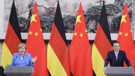 Chinese Premier Li Keqiang (R) and German Chancellor Angela Merkel attend a joint news conference at the Great Hall of the People in Beijing on May 24, 2018. 