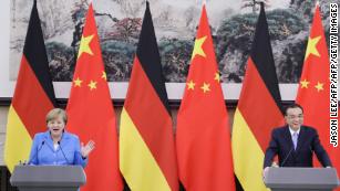 Chinese Premier Li Keqiang (R) and German Chancellor Angela Merkel attend a joint news conference at the Great Hall of the People in Beijing on May 24, 2018. 