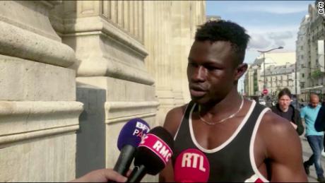 Mamoudou Gassama was watching a football game when he realized the child was in danger.