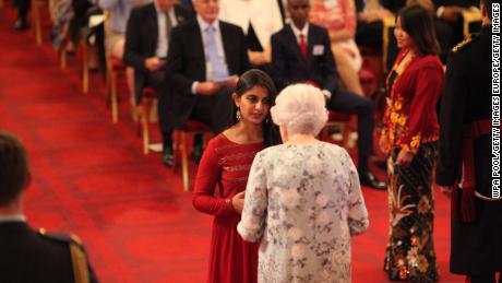 Suhani Jalota receiving a Queen&#39;s Young Leaders Award from Queen Elizabeth II at Buckingham Palace on June 29, 2017.