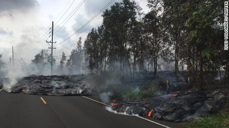 Lava creeps across Pohoiki Street in Leilani Estates.