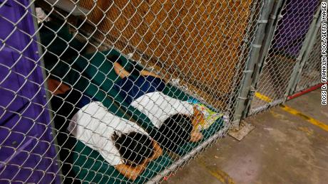 Two female detainees sleep in a holding cell at a US Customs and Border Protection facility in Nogales, Arizona, in 2014.