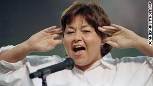 Roseanne Barr holds as she screams the National Anthem in 1990.