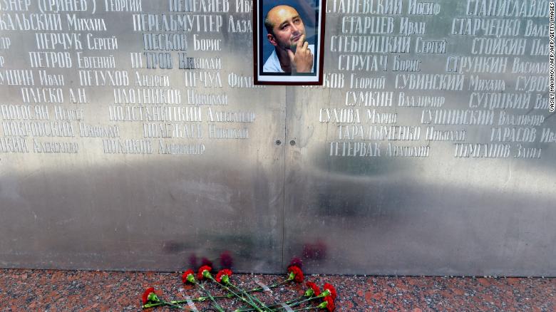 Flowers lie under a picture of Babchenko placed on the memorial wall of Moscow's journalists house before he was revealed to be alive.