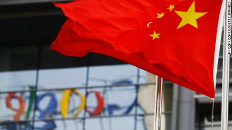 The Google logo is reflected in windows of the company&#39;s China head office as the Chinese national flag flies in the wind in Beijing on March 23, 2010 after the US web giant said it would no longer filter results and was redirecting mainland Chinese users to an uncensored site in Hong Kong -- effectively closing down the mainland site. Google&#39;s decision to effectively shut down its Chinese-language search engine is likely to stunt the development of the Internet in China and isolate local web users, analysts say.  AFP PHOTO/LI XIN (Photo credit should read li xin/AFP/Getty Images)