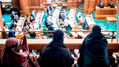 Women wearing niqab sit in the audience at the Danish Parliament in Copenhagen on Thursday.