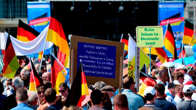 At an AfD rally on May 27,  supporters hold placards reading "No Islam in Germany."