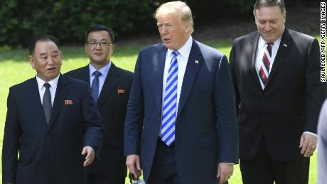 US President Donald Trump (C-R), flanked by US Secretary of State Mike Pompeo (R), walks with North Korean Kim Yong Chol (L) at the White House on June 1, 2018 in Washington,DC. (SAUL LOEB/AFP/Getty Images)
