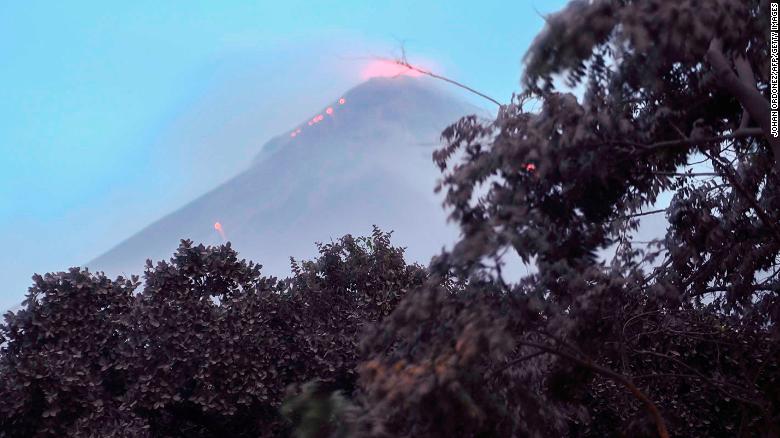 Volcanic activity at Fuego is visible Monday in Los Lotes, south of Guatemala City. 
