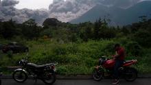 Volcan de Fuego, or Volcano of Fire, blows outs a thick cloud of ash, as seen from Alotenango, Guatemala, Sunday, June 3, 2018. One of Central America&#39;s most active volcanos erupted in fiery explosions of ash and molten rock Sunday, killing people and injuring many others while a towering cloud of smoke blanketed nearby villages in heavy ash. (AP Photo/Santiago Billy)