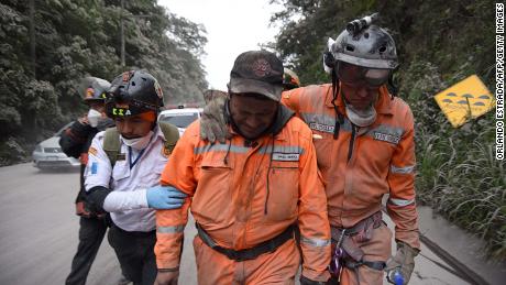 Volunteer firefighter cries after leaving a rescue site in Escuintla.