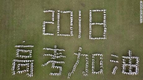 Aerial view of senior students of Hanjiang High School of Jiangsu Province posing as Chinese characters &quot;2018 Gaokao Come On&quot; during stress relief event ahead of the annual national college entrance examination.