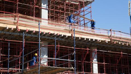 Workers construct the new government hospital in the capital Mbabane funded in part and built by Taiwan.