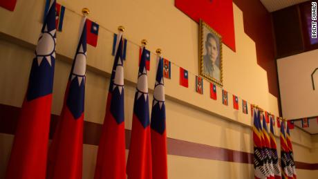 Flags hang next to a picture of Taiwan&#39;s founder in the embassy, Taiwan&#39;s last in Africa.