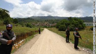 Soldiers guard the streets at the entrance of a Burmese village under militia control.