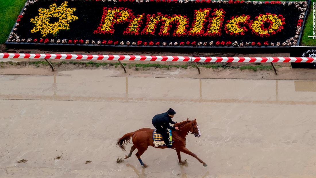 Kentucky Derby winner Justify gallops in preparation for the Preakness at Pimlico Race Course on May 15, 2018, in Baltimore.