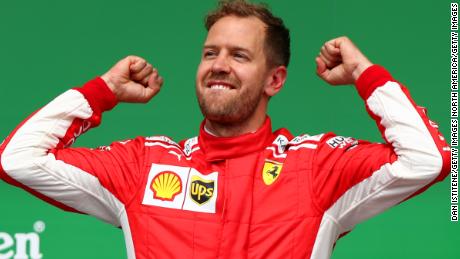 Sebastian Vettel celebrates his victory in the Canadian GP in Montreal to take the title lead.