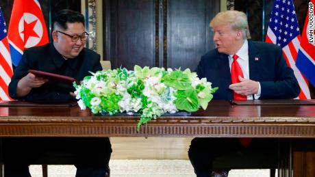 North Korea leader Kim Jong Un and U.S. President Donald Trump exchanged signed documents at the Capella resort on Sentosa Island Tuesday, June 12, 2018 in Singapore. 