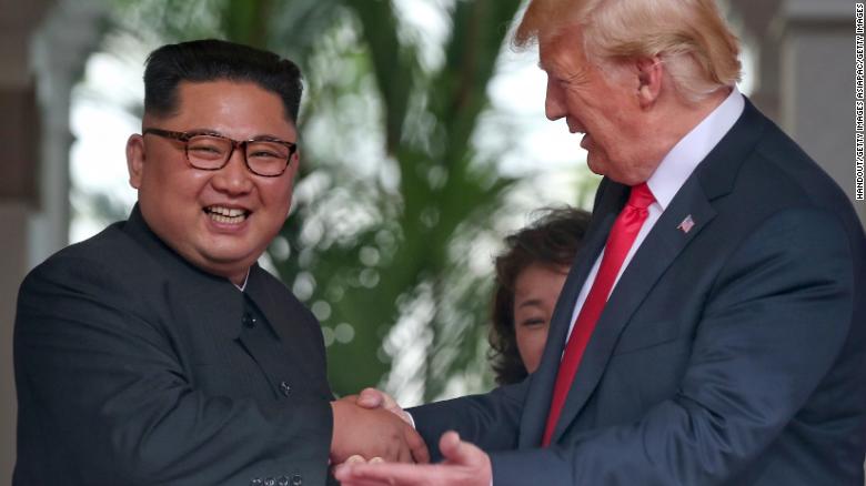 SINGAPORE - JUNE 12: In this handout photo, North Korean leader Kim Jong-un shakes hands with U.S. President Donald Trump during their historic U.S.-DPRK summit at the Capella Hotel on Sentosa island on June 12, 2018 in Singapore. U.S. President Trump and North Korean leader Kim Jong-un held the historic meeting between leaders of both countries on Tuesday morning in Singapore, carrying hopes to end decades of hostility and the threat of North Korea&#39;s nuclear program. (Photo by Kevin Lim/THE STRAITS TIMES/Handout/Getty Images)