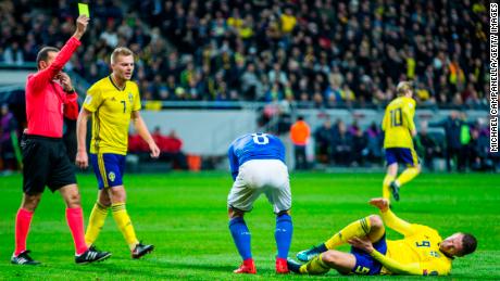 Marco Verratti of Italy is shown a yellow card for his foul on Marcus Berg of Sweden during the FIFA 2018 World Cup Qualifier 