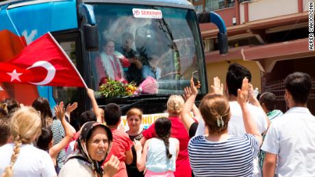 People from the small southern town of Samandag welcome Aksener on the street.