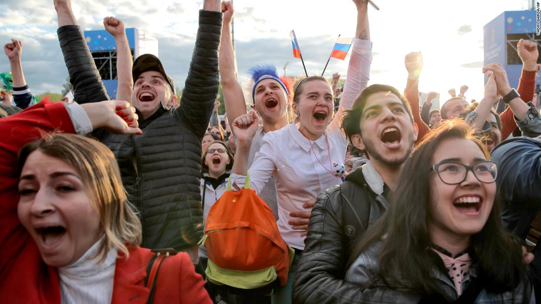 Fans watching from Yekaterinburg, Russia, celebrate Russia&#39;s first goal.