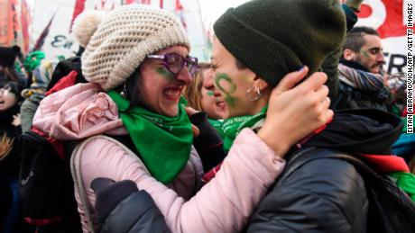 Supporters of legalized abortion embrace Thursday after the the vote in the Chamber of Deputies.