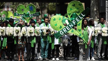 Grenfell Tower victims remembered with silent walk one year after fire