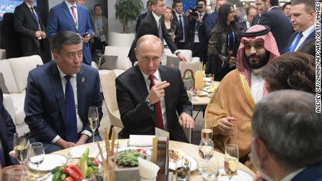 Putin and Mohammed bin Salman (R) take a break at half-time of the Russia-Saudi Arabia match.