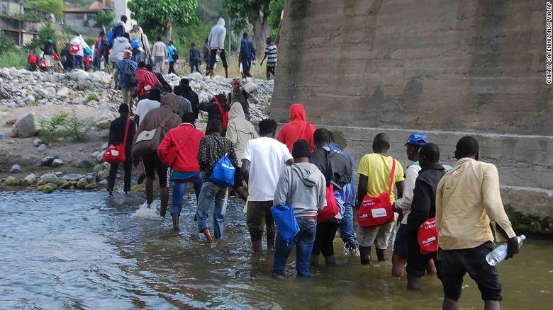 Migrants walking along the Roja river, near Ventimiglia, Italy, toward the French border.