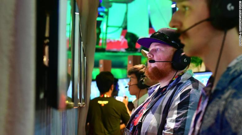 Gamers play &quot;Fortnite&quot; on PS4 consoles at E3 2018 in Los Angeles, California.