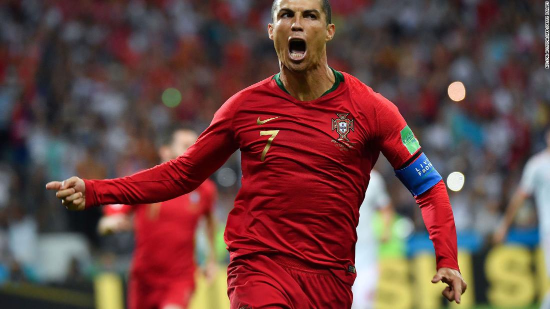 Portugal star Cristiano Ronaldo celebrates his first-half penalty against Spain on June 15. He added two more goals in the 3-3 draw.